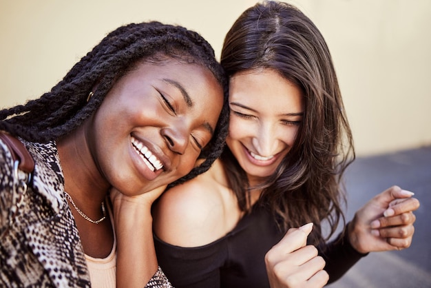 Girl friends laugh and happiness outdoor with funny joke and smile from love and support Comedy women and happy young people with diversity in town laughing with street fashion and friendship