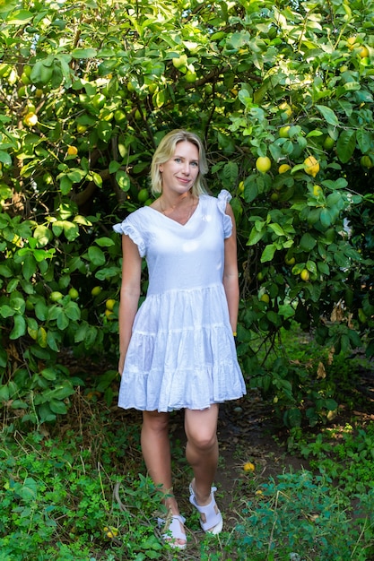 Girl in the garden with oranges fruit