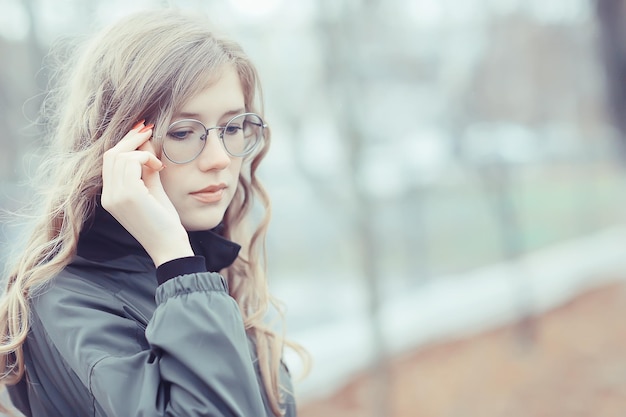 girl glasses autumn portrait, an adult woman glamorous autumn look