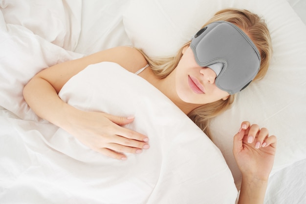 girl in a gray modern sleep mask