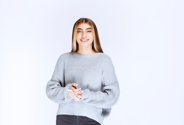 Girl in grey shirt giving pretty and neutral poses.