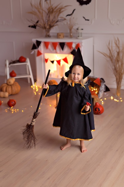 girl in halloween witch costume