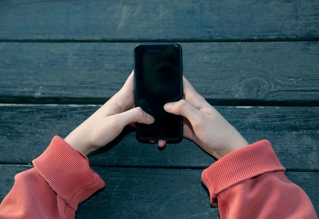 Girl hand holding mobile phone