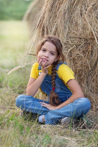 girl on hay bale