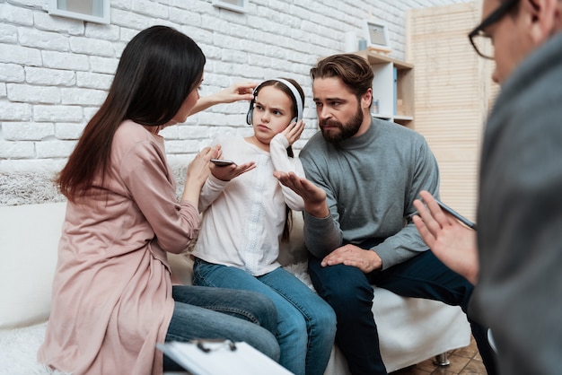 Girl in Headphones Ignore Parents Therapy Session