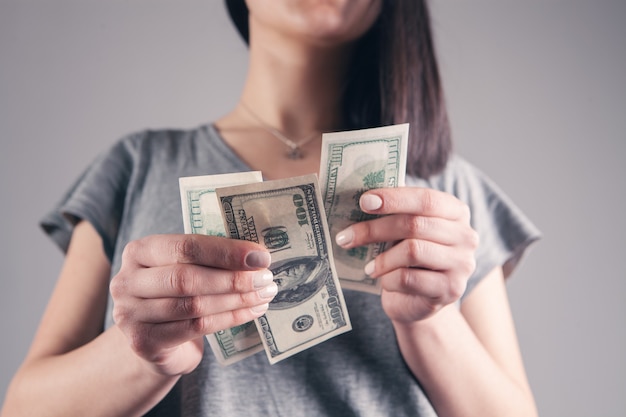 Girl holding big money in her hands