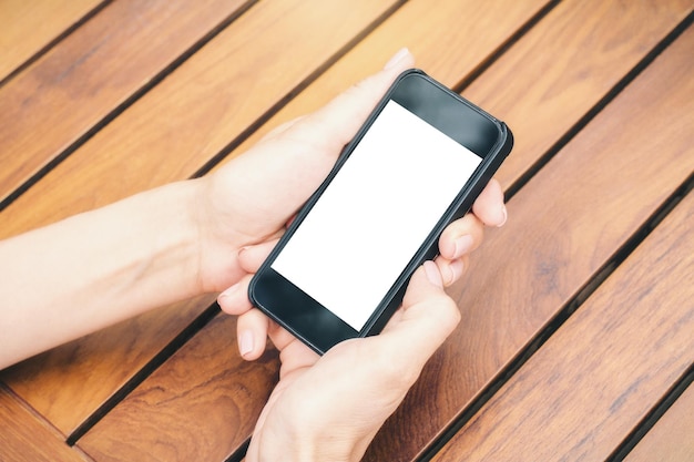 Girl holding blank white smartphone