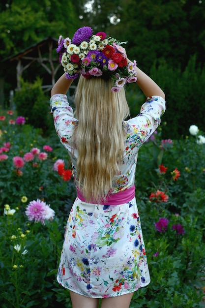 girl holding a bouquet of flowers on her head