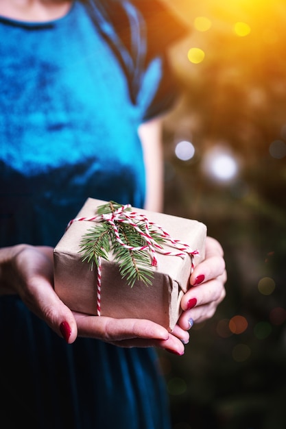 Girl holding christmas presents in hands   happy New Years