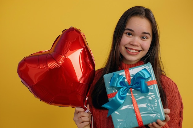 Photo a girl holding a gift with a bow and a present in the corner