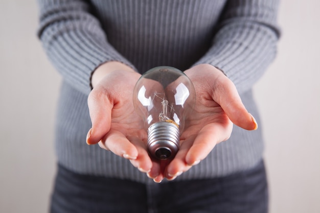 Girl holding a light bulb