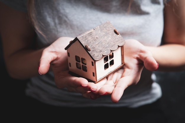 Girl holding a model at home