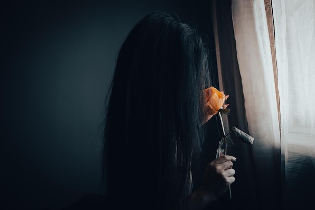 Girl holding a red rose