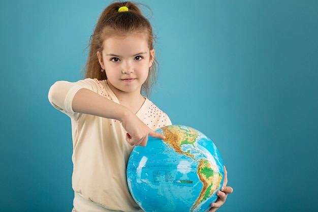 Girl holding world globe