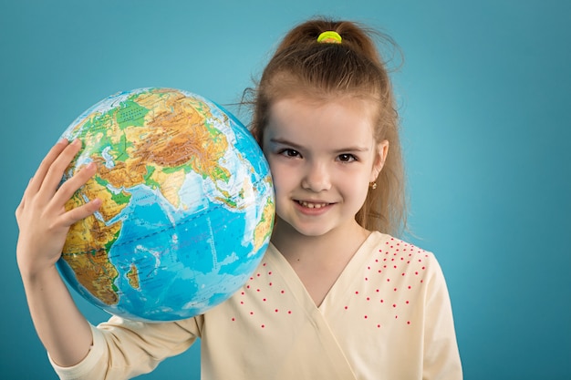 Girl holding world globe