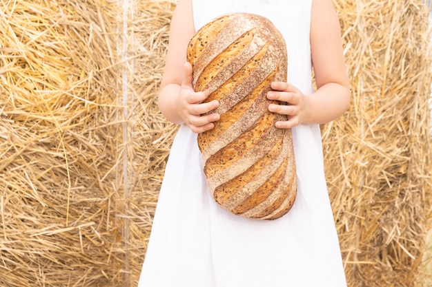 girl holds eco natural bread in her hands