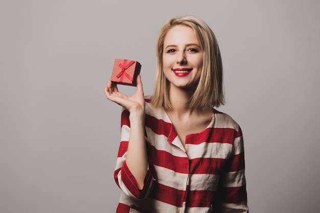 Girl holds gift box