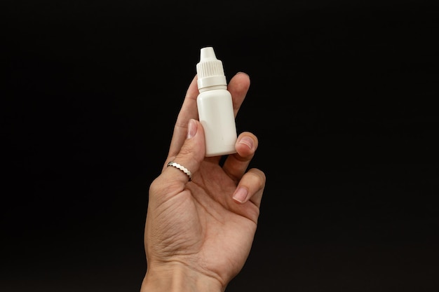 A girl is holding a vial of liquid in an urk