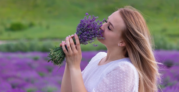 The girl is resting in the lavender field