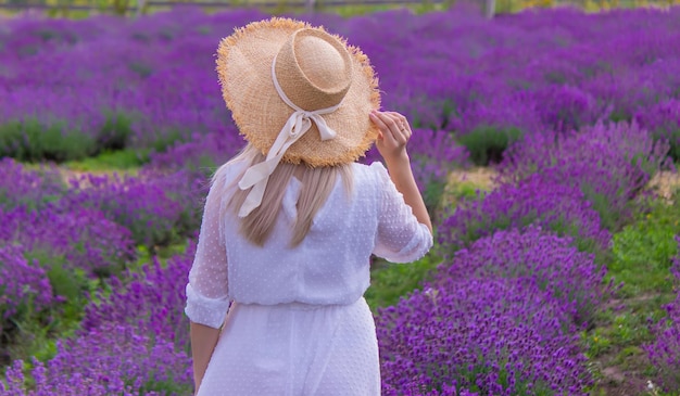 The girl is resting in the lavender field