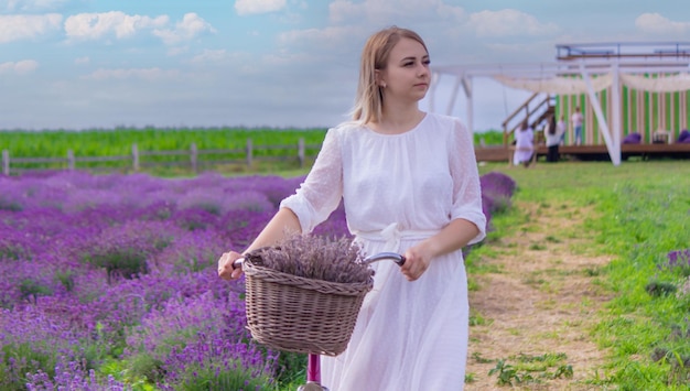 The girl is resting in the lavender field