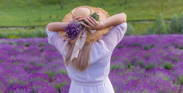 The girl is resting in the lavender field