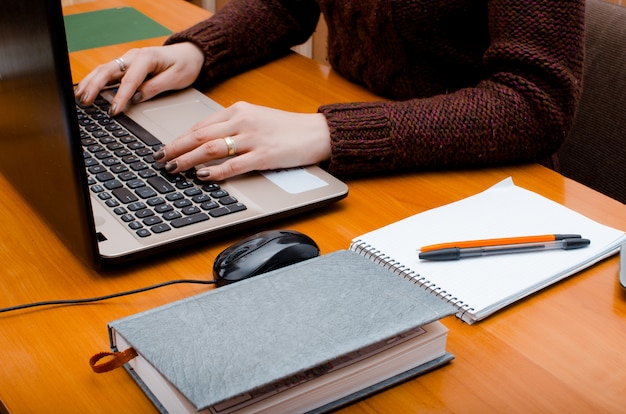 The girl is working at the computer. Work in the office. Concept