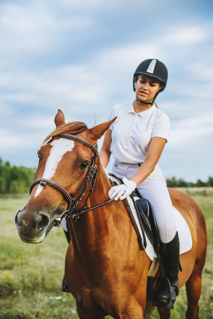 Girl jockey riding a horse