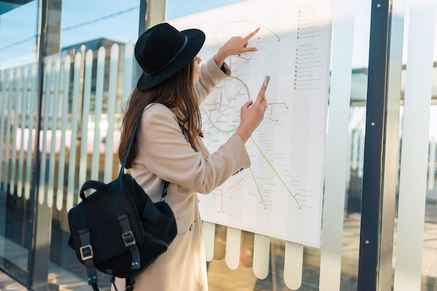 Girl looks at the city map