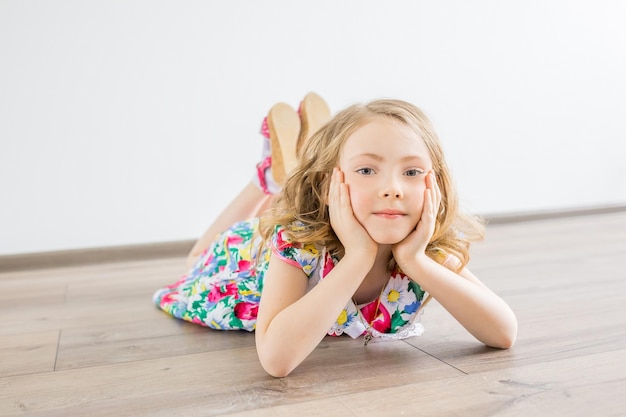 Girl lying on floor and watching something