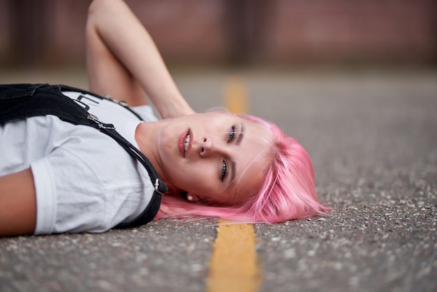 girl lying on the street