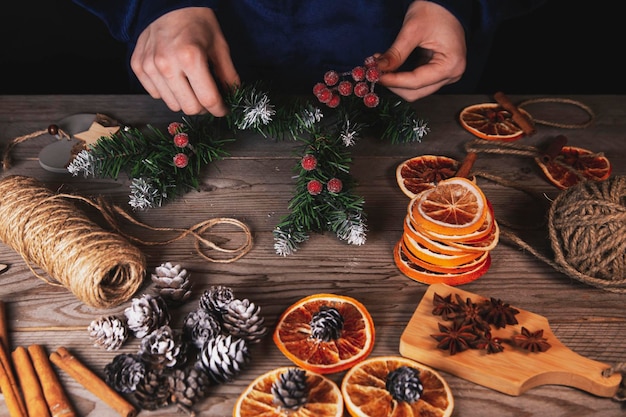 The girl makes vintage Christmas decorations at home Celebrating Christmas and New Year