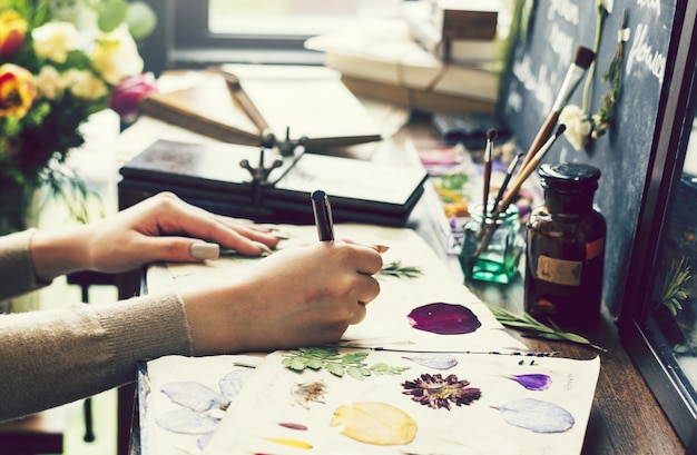 Girl making crafts with dried flowers