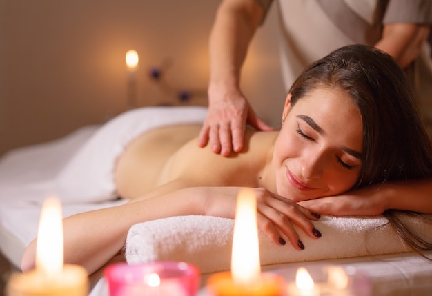 Girl on massage in the spa salon.