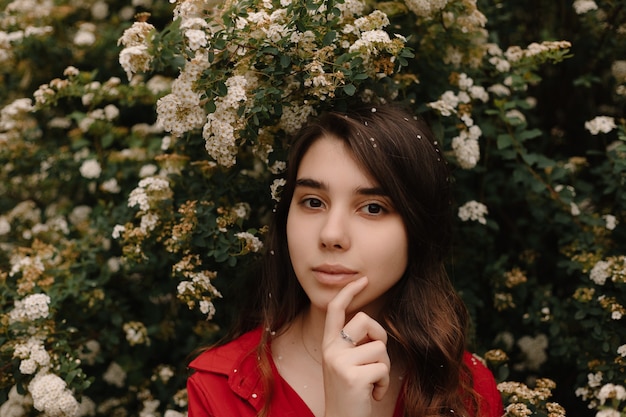 girl in a medical mask with flowers