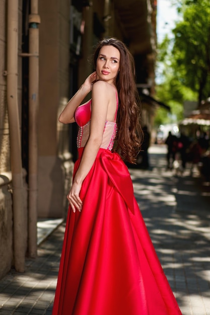 Girl model in a white dress on the street