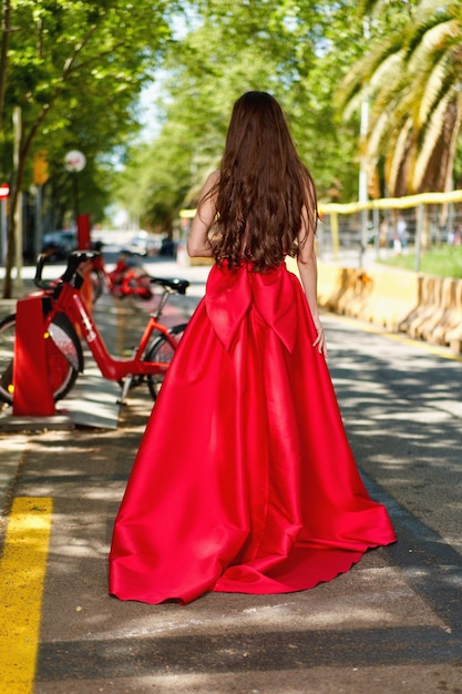 Girl model in a white dress on the street