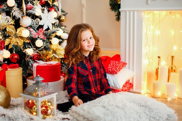 Girl near Christmas tree