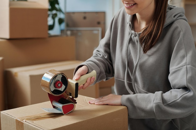 Girl packing things in boxes