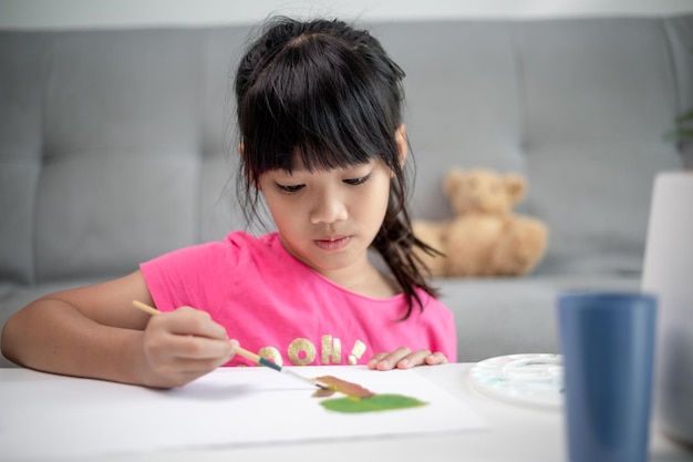 Girl PaintingGirl Painting Picture On Table At Home Picture On Table At Home