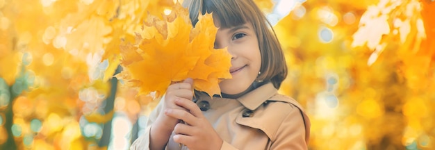 girl in the park with autumn leaves