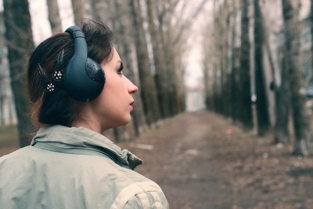 Girl in park with headphone