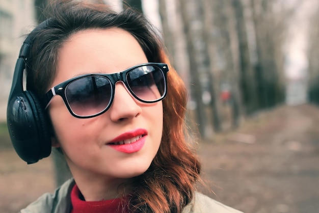 Girl in park with headphone