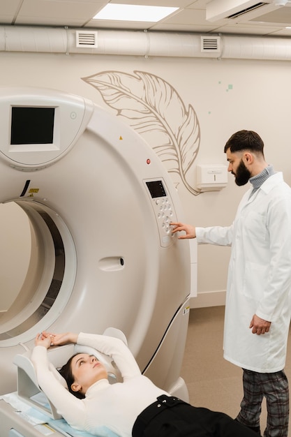 Girl patient is doing CT computed tomography xray scan of chest for examination of abdomen in a CT scanning room CT scan of abdomen of woman in medical clinic