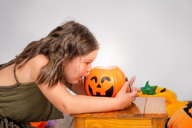 Girl peeking into jackolantern