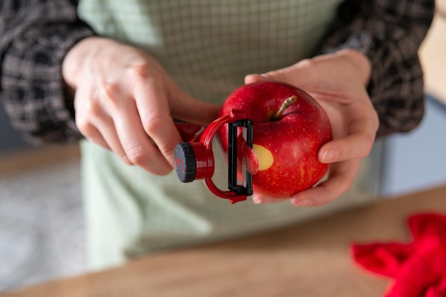 girl peeling an apple, home cooking food, kitchen background