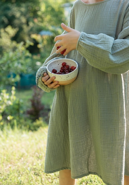 Girl picking cherries