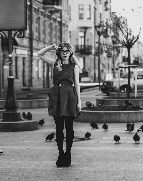 Girl and pigeons lifestyle and fashion black and white picture