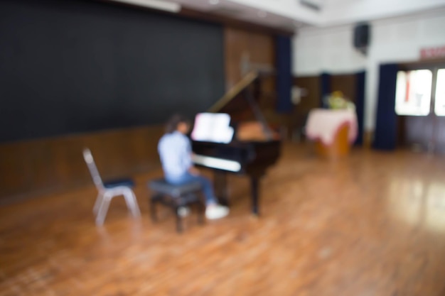 Girl playing the piano Blur image