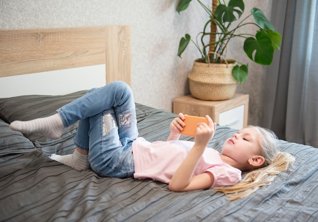 Girl playing on smartphone